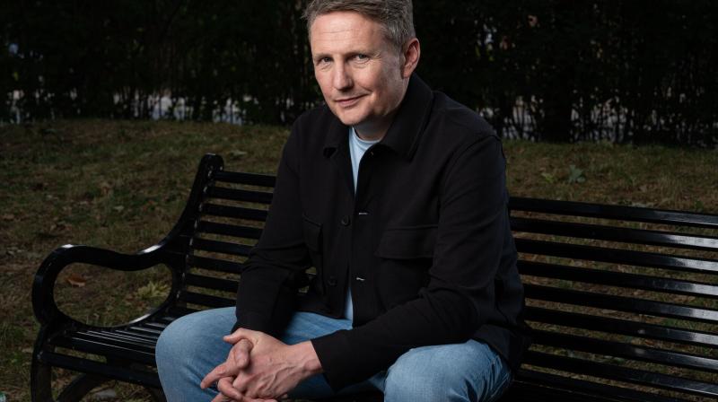 Promotional image from My Sexual Abuse The Sitcom, featuring comedian Mark O'Sullivan sitting on a bench.