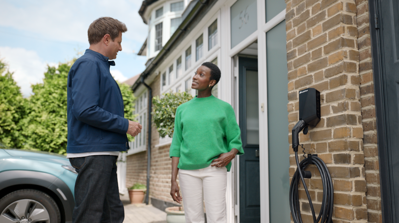 It shows George Clark talking to a women on the doorstep chatting 