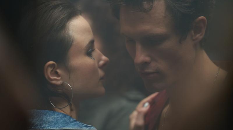 Pictured: Alina (Anna Prochniak) and Marijonas (Arnas Fedaravicius