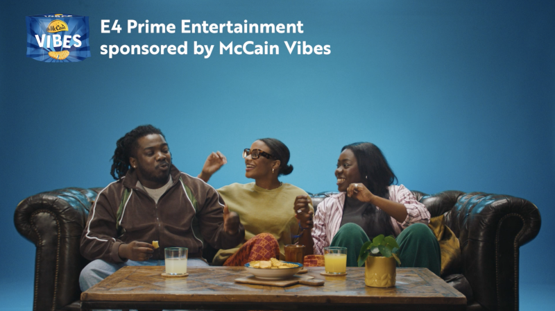 An image of three people on the sofa enjoying McCains Vibes while smiling at eachother. 
