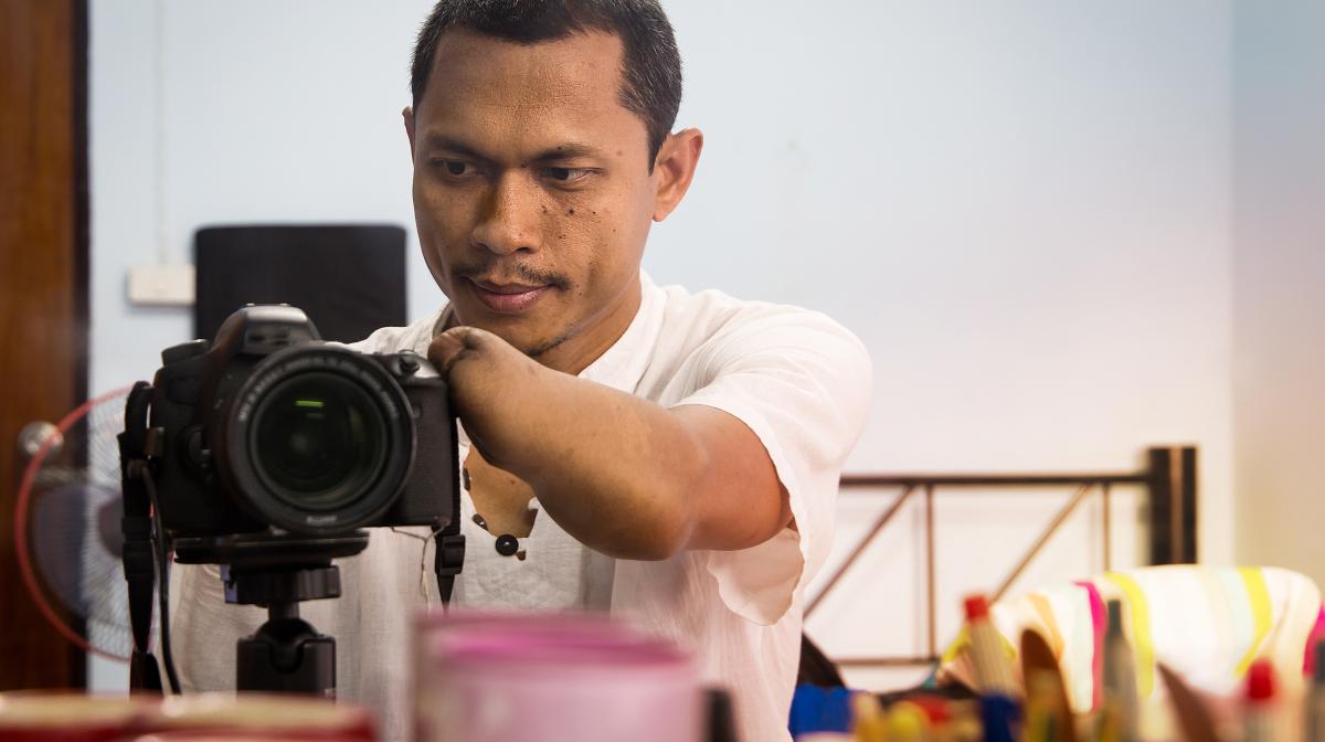 Man operating a camera
