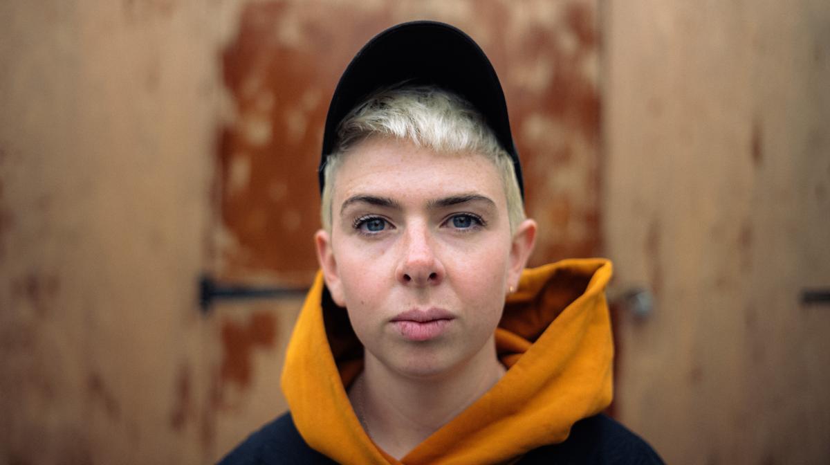 Headshot of Molly Manning Walker wearing a cap