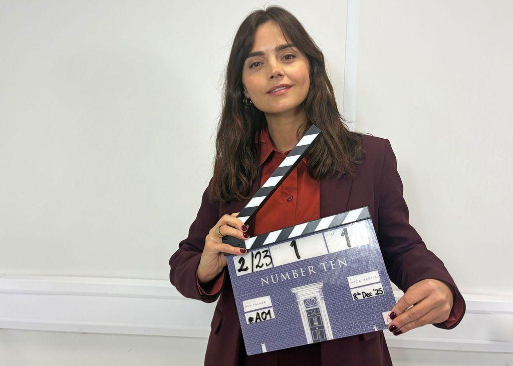 Jenna Coleman holding a clapperboard